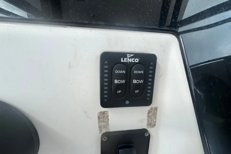 Slide: The Image of Lenco trim tab control panel on 2011 Donzi 29 ZF Open boat. - 38