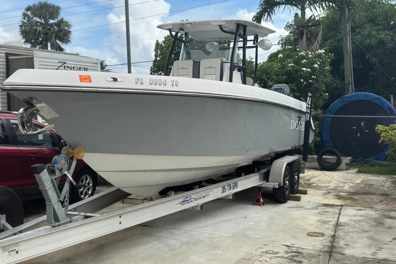 Slide: The Image of 2011 Donzi 29 ZF Open boat on trailer, parked outdoors. - 3