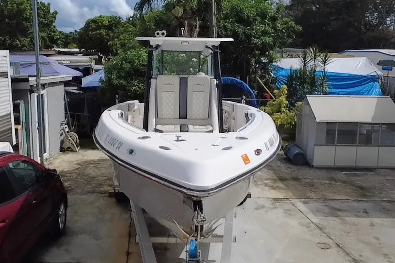 Slide: The Image of 2011 Donzi 29 ZF Open boat on trailer, parked outdoors. - 10