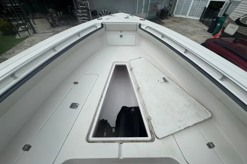 Slide: The Image of 2011 Donzi 29 ZF Open boat with open storage compartment on deck. - 49