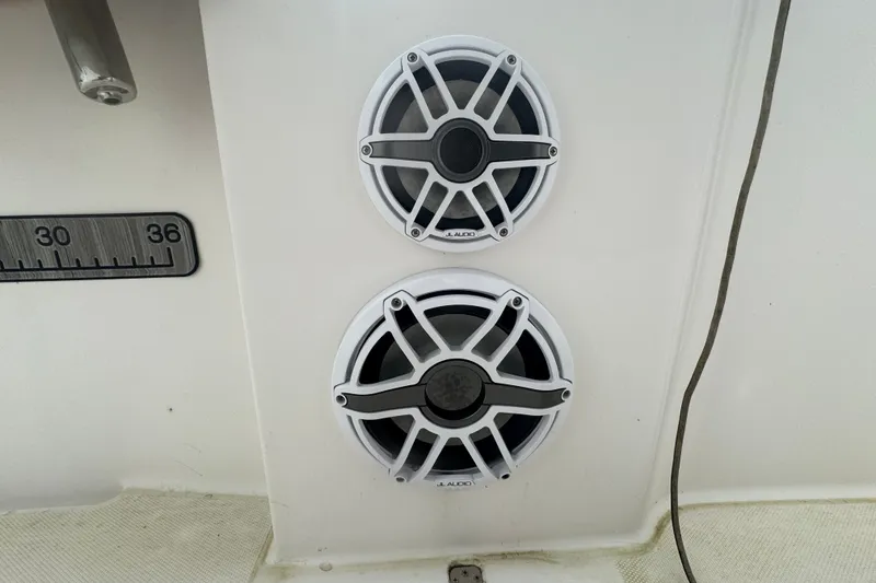 Slide: The Image of Speakers on a 2011 Donzi 29 ZF Open boat, featuring JL Audio components. - 37