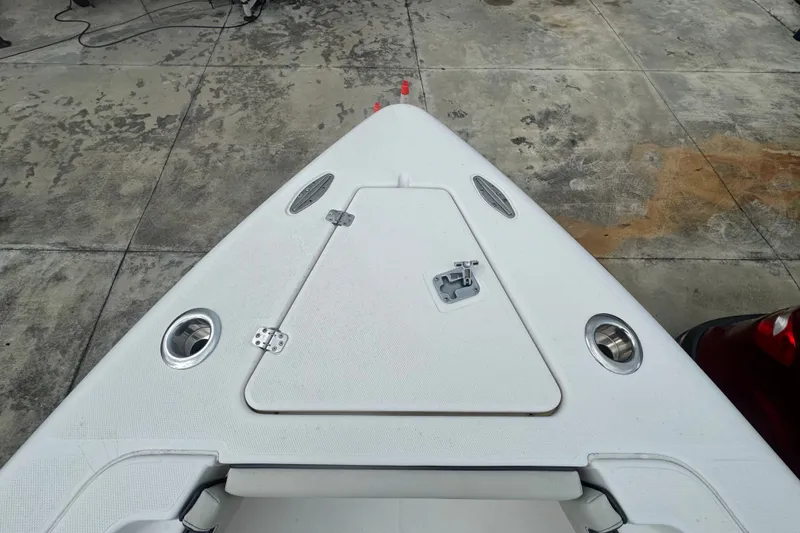 Slide: The Image of Bow of 2011 Donzi 29 ZF Open boat on concrete surface. - 50