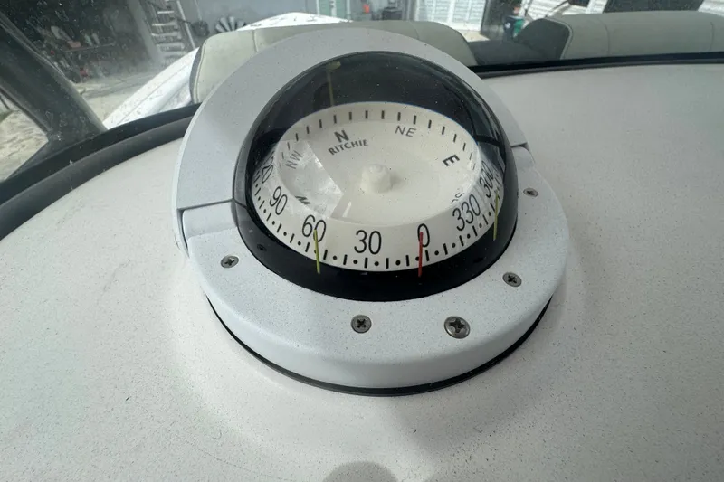 Slide: The Image of Compass on 2011 Donzi 29 ZF Open boat dashboard, showing navigation details. - 40