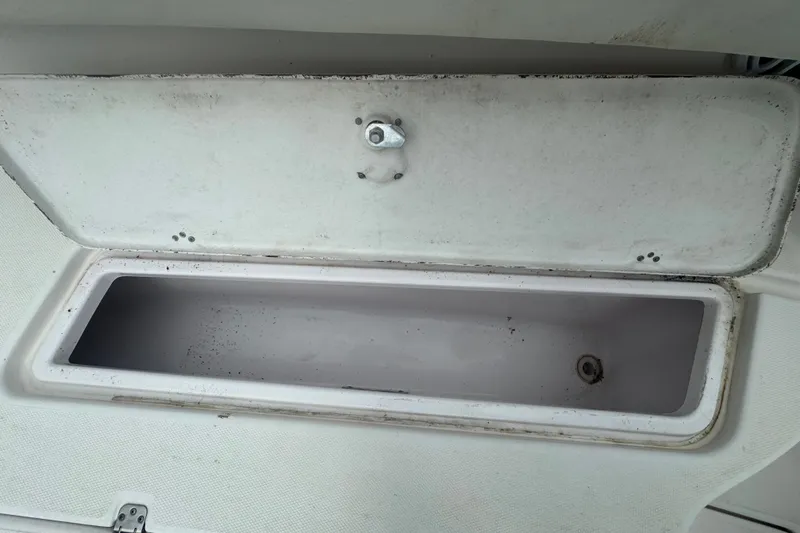 Slide: The Image of Open storage compartment on a 2011 Donzi 29 ZF Open boat. - 48