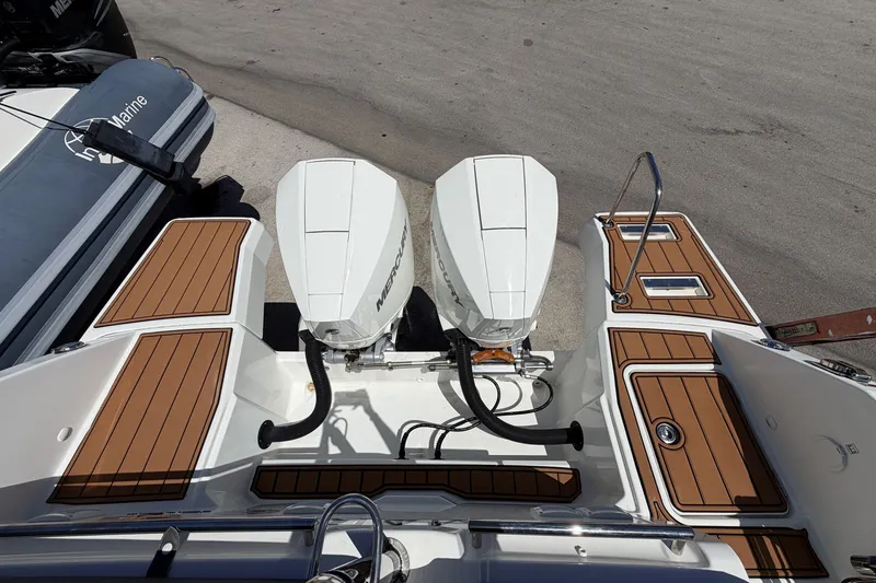 Slide: The Image of 2022 Jeanneau Leader 9.0 CC boat with twin Mercury outboard engines. - 30