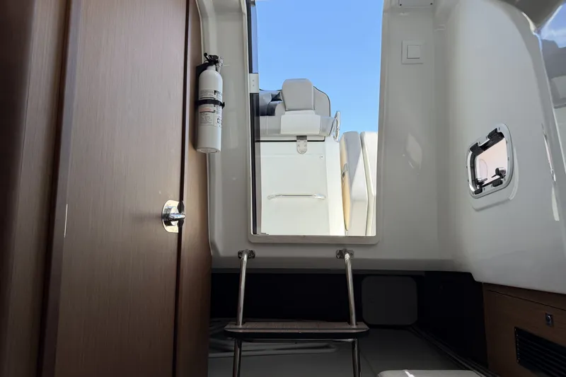 Slide: The Image of Interior view of 2022 Jeanneau Leader 9.0 CC boat with ladder and fire extinguisher. - 22