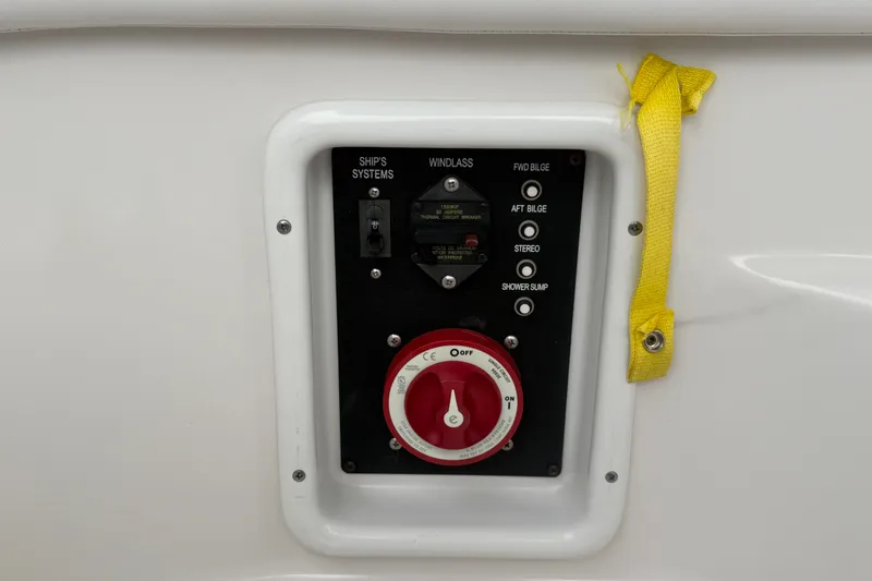 Slide: The Image of Control panel of 2011 Four Winns V285 boat with switches and red dial. - 114