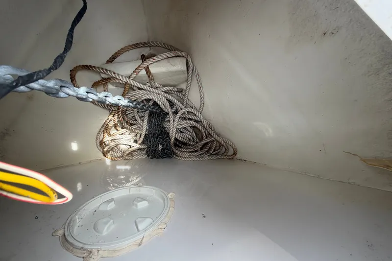 Slide: The Image of Anchor locker of 2011 Four Winns V285 boat with ropes and chains. - 36