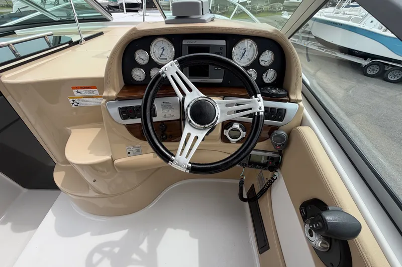 Slide: The Image of Steering console of 2011 Four Winns V285 boat with gauges and controls. - 22