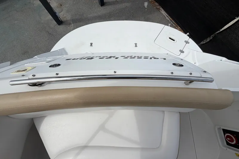 Slide: The Image of 2011 Four Winns V285 boat deck with stainless steel railing and cushioned seating. - 116