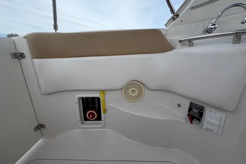 Slide: The Image of Interior view of a 2011 Four Winns V285 boat, featuring control panel and speaker. - 113