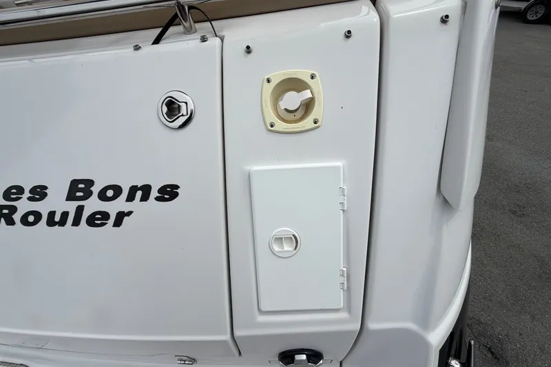 Slide: The Image of 2011 Four Winns V285 boat stern with utility access panel and fittings. - 7