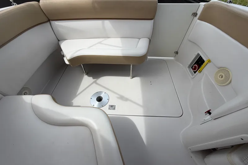Slide: The Image of 2011 Four Winns V285 boat interior with beige and white seating. - 108