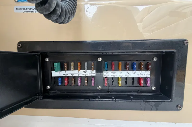 Slide: The Image of Fuse panel of a 2011 Four Winns V285 boat, showcasing various colored fuses. - 20