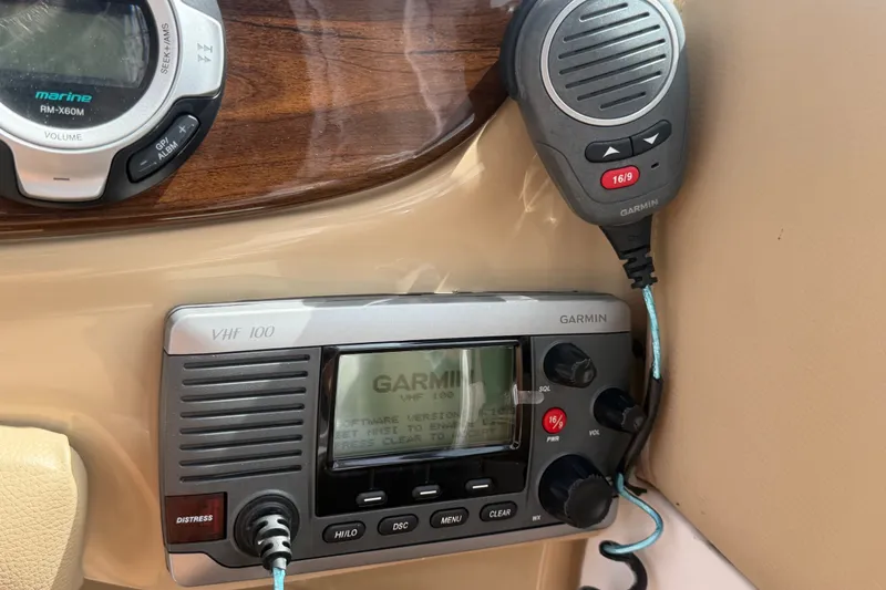 Slide: The Image of Garmin VHF 100 marine radio on 2011 Four Winns V285 boat dashboard. - 29