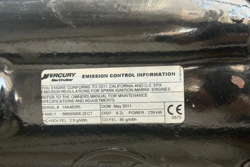 Slide: The Image of Emission control label on 2011 Four Winns V285 boat engine, Mercury MerCruiser specifications. - 118