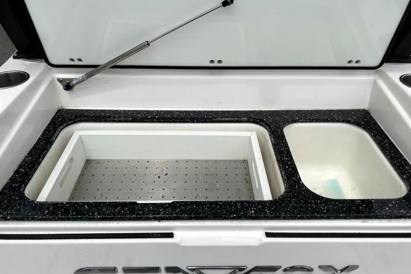 Slide: The Image of 2024 Sea Fox 328 Commander boat storage compartments with open lids. - 22
