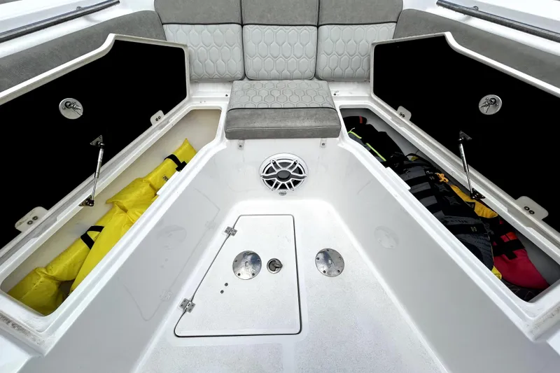 Slide: The Image of 2024 Sea Fox 328 Commander boat storage compartments with life jackets and seating. - 53