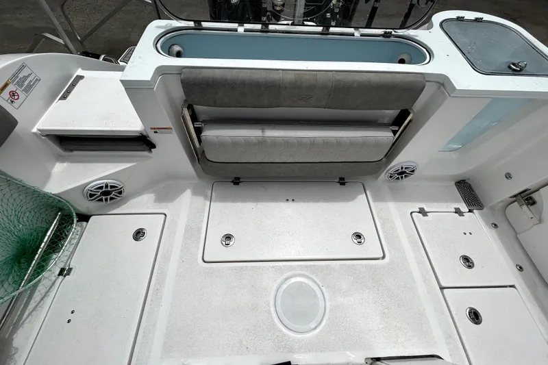 Slide: The Image of 2024 Sea Fox 328 Commander boat deck with seating and storage compartments. - 68