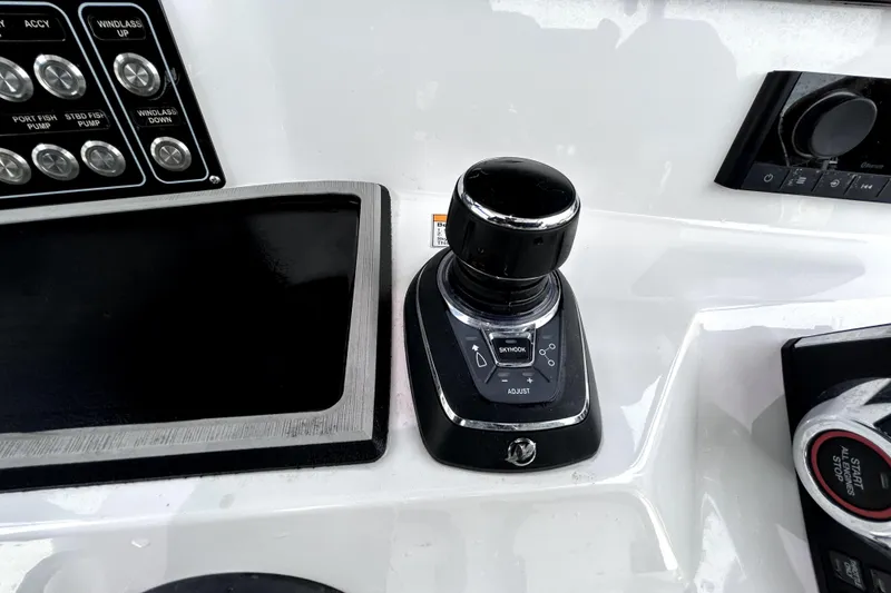 Slide: The Image of Control panel of 2024 Sea Fox 328 Commander boat with joystick and buttons. - 33