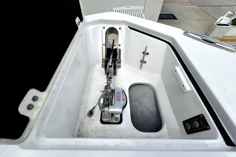 Slide: The Image of Anchor compartment of 2024 Sea Fox 328 Commander boat, featuring chain and winch system. - 57