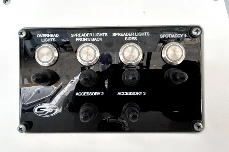 Slide: The Image of Control panel of 2024 Sea Fox 328 Commander with labeled switches for lights and accessories. - 36