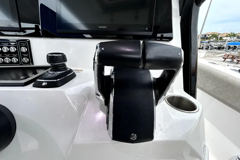Slide: The Image of 2024 Sea Fox 328 Commander helm with controls and navigation display. - 35