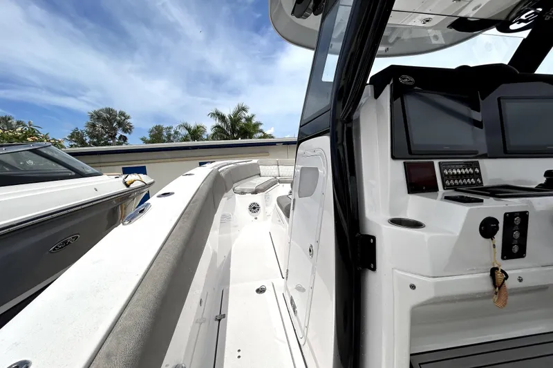 Slide: The Image of 2024 Sea Fox 328 Commander boat interior with modern dashboard and seating. - 43