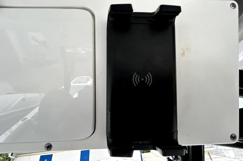 Slide: The Image of 2024 Sea Fox 328 Commander dashboard with wireless charging mount. - 38
