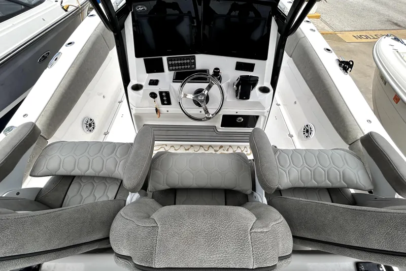 Slide: The Image of 2024 Sea Fox 328 Commander boat cockpit with modern steering and seating. - 27