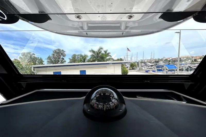 Slide: The Image of Interior view from a 2024 Sea Fox 328 Commander boat, showcasing the compass and marina. - 37