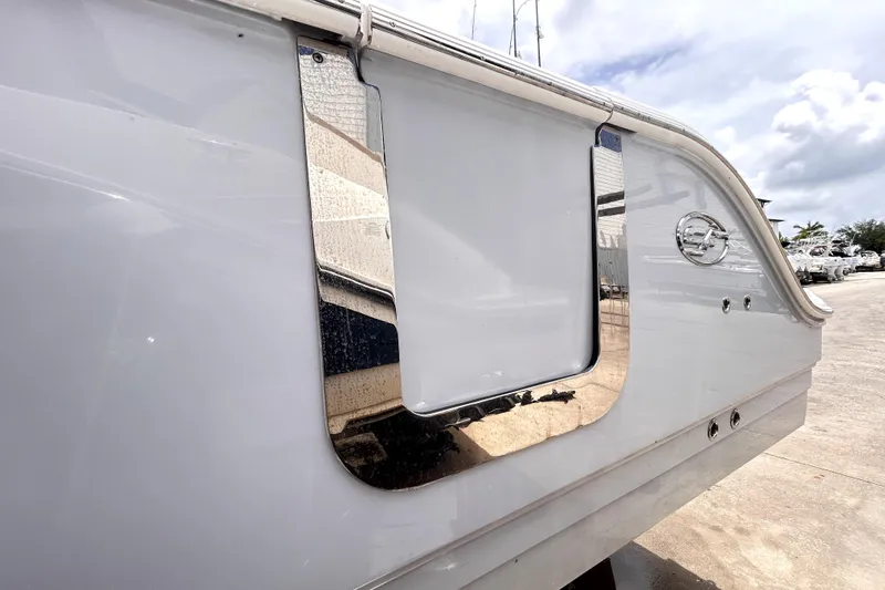 Slide: The Image of 2024 Sea Fox 328 Commander boat detail with chrome accents and sleek design. - 15
