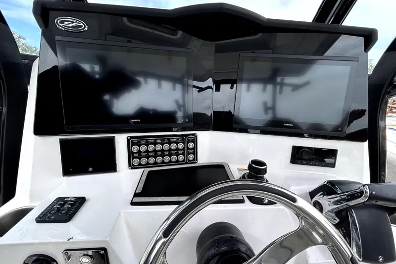 Slide: The Image of 2024 Sea Fox 328 Commander helm with dual Garmin displays and advanced controls. - 30