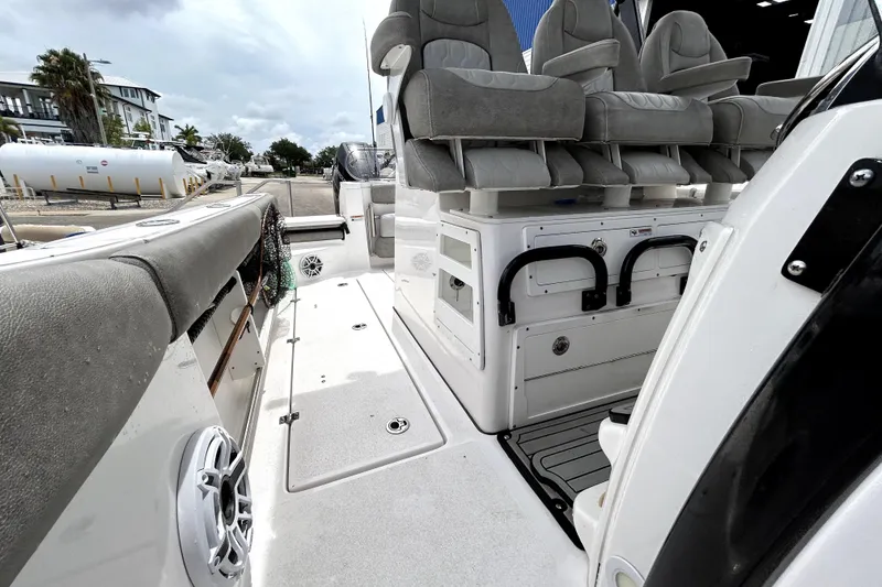 Slide: The Image of 2024 Sea Fox 328 Commander boat interior with seating and storage compartments. - 64