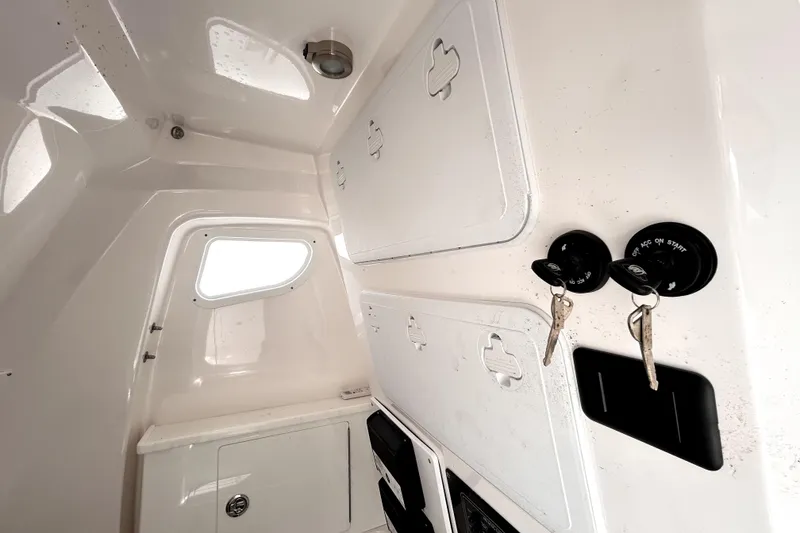 Slide: The Image of Interior view of 2024 Sea Fox 328 Commander boat cabin with keys and storage compartments. - 47