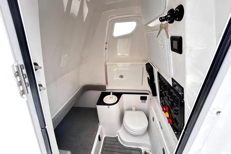 Slide: The Image of 2024 Sea Fox 328 Commander interior cabin with toilet and control panel. - 44
