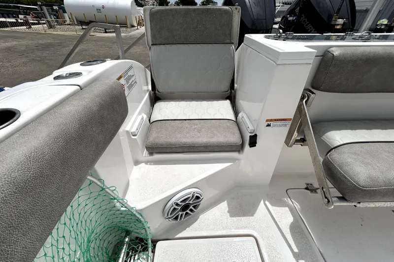 Slide: The Image of 2024 Sea Fox 328 Commander boat seating area with gray cushions and speaker. - 77