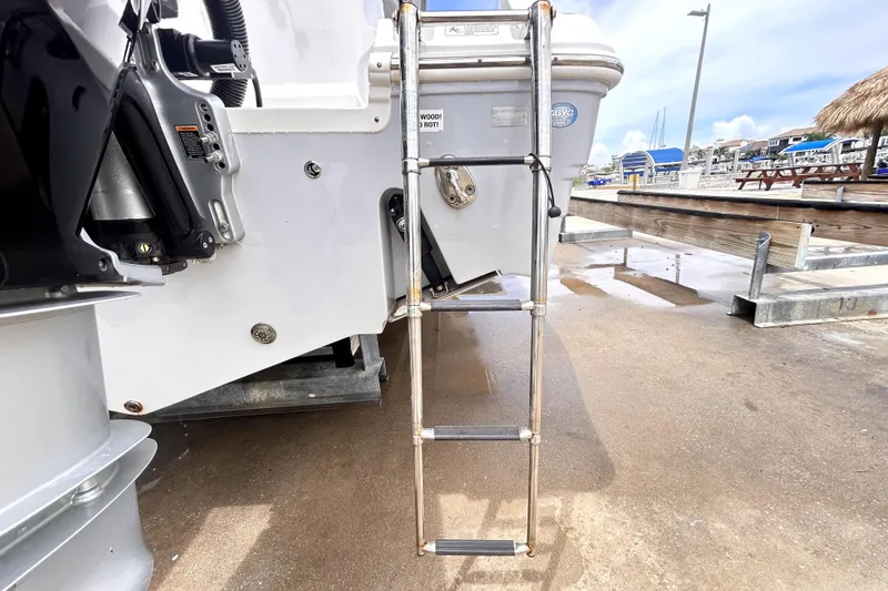 Slide: The Image of 2024 Sea Fox 328 Commander boat ladder on dockside, showcasing marine equipment. - 14