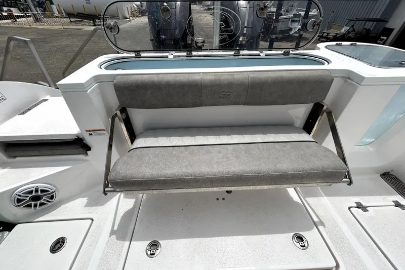 Slide: The Image of 2024 Sea Fox 328 Commander boat with gray cushioned seating and sleek design. - 74