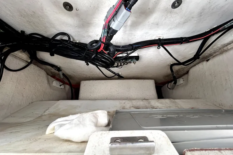 Slide: The Image of Interior view of 2024 Sea Fox 328 Commander boat wiring and storage compartment. - 40