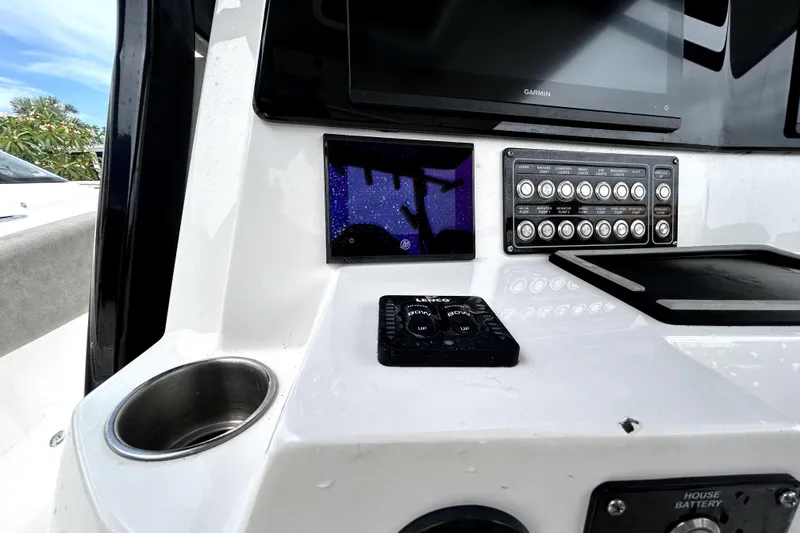 Slide: The Image of 2024 Sea Fox 328 Commander dashboard with control panel and Garmin display. - 31