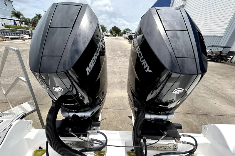 Slide: The Image of Twin Mercury Verado engines on a 2024 Sea Fox 328 Commander boat. - 80