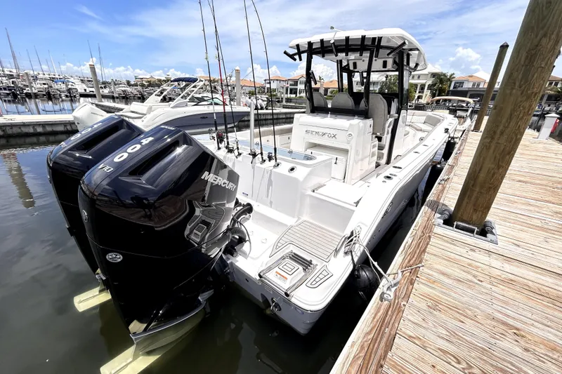 Slide: The Image of 2024 Sea Fox 328 Commander boat docked with dual Mercury 400 engines. - 17