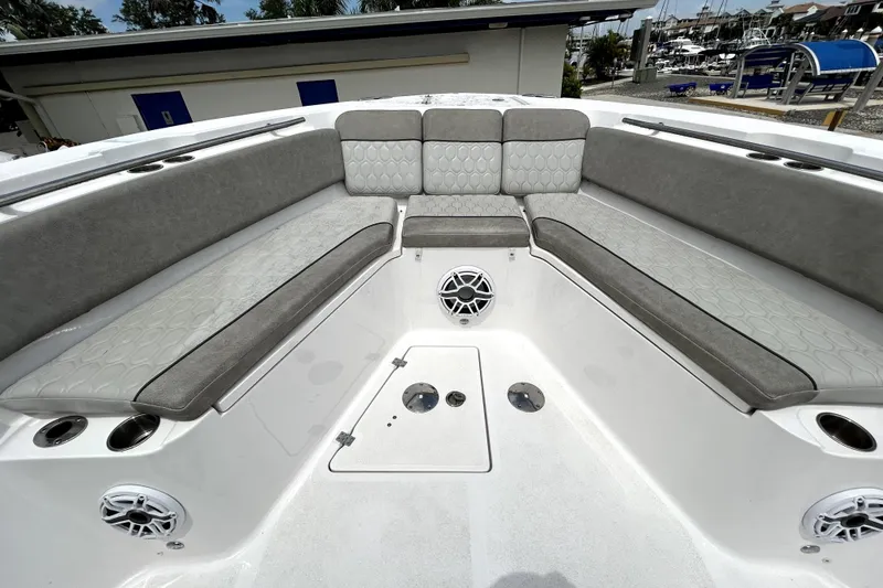 Slide: The Image of 2024 Sea Fox 328 Commander boat interior with cushioned seating and speakers. - 51