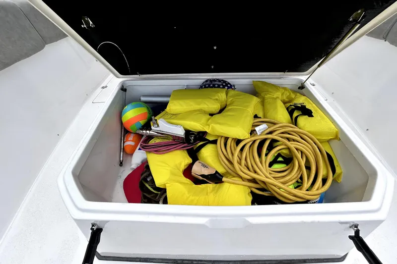 Slide: The Image of Storage compartment of 2024 Sea Fox 328 Commander with life jackets and boating gear. - 63