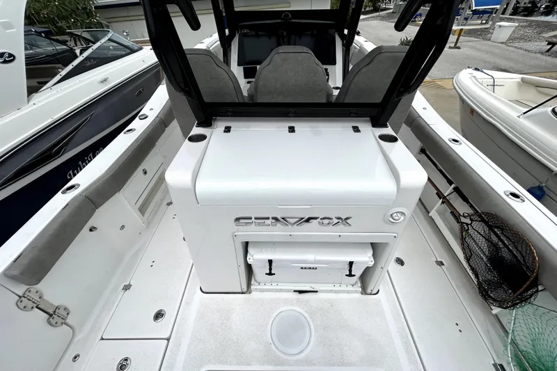 Slide: The Image of 2024 Sea Fox 328 Commander boat interior with seating and storage compartments. - 19