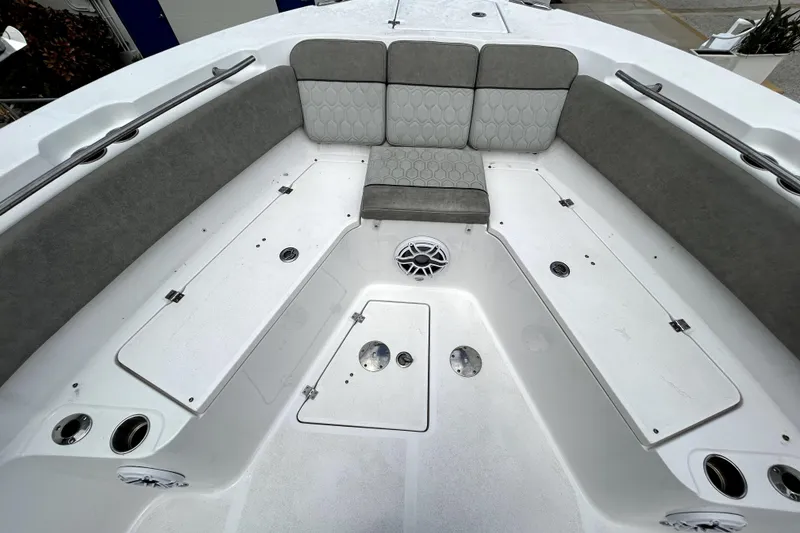 Slide: The Image of 2024 Sea Fox 328 Commander boat interior with cushioned seating and storage compartments. - 52