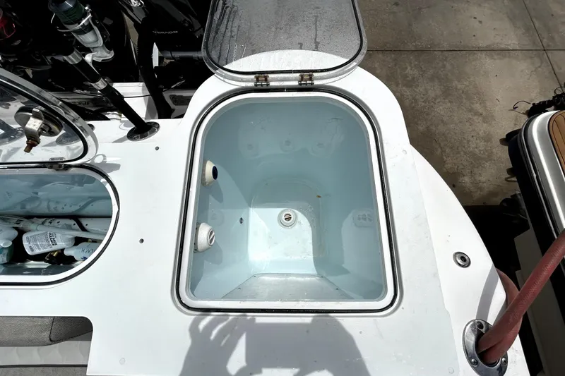 Slide: The Image of 2024 Sea Fox 328 Commander livewell with open lid, showcasing interior features. - 76