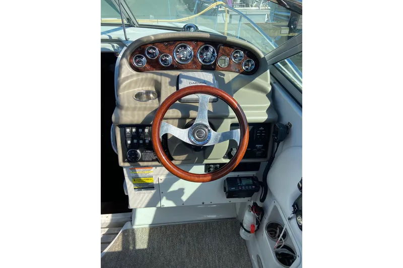 Slide: The Image of Steering wheel and dashboard of a 2012 Crownline 260 CR boat. - 8