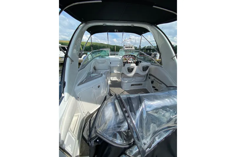 Slide: The Image of Interior view of 2012 Crownline 260 CR boat, featuring sleek design and comfortable seating. - 5
